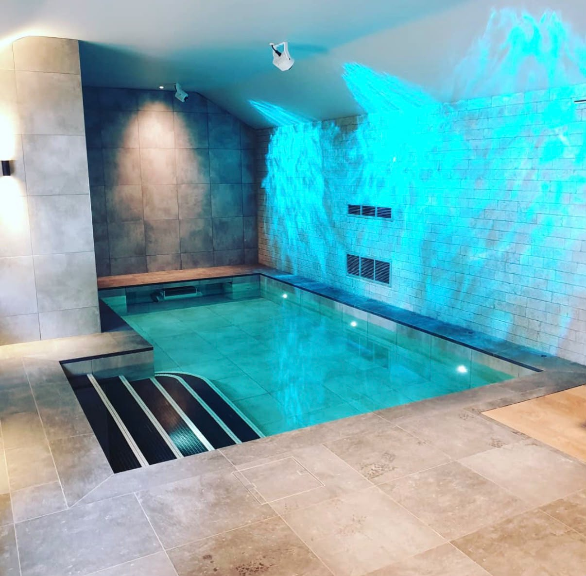 Indoor pool tiling and stone flooring