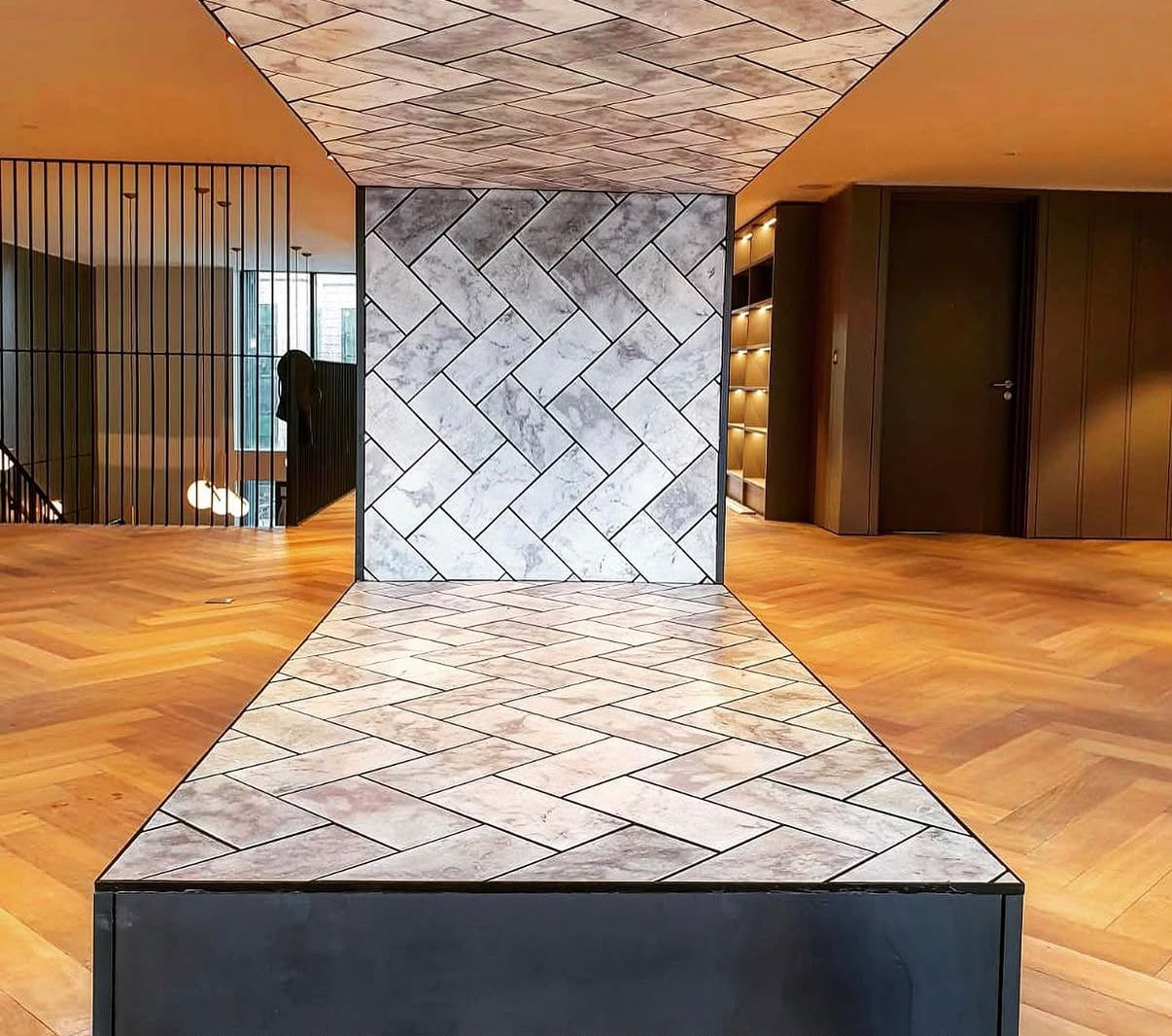 Herringbone tiled feature installation
